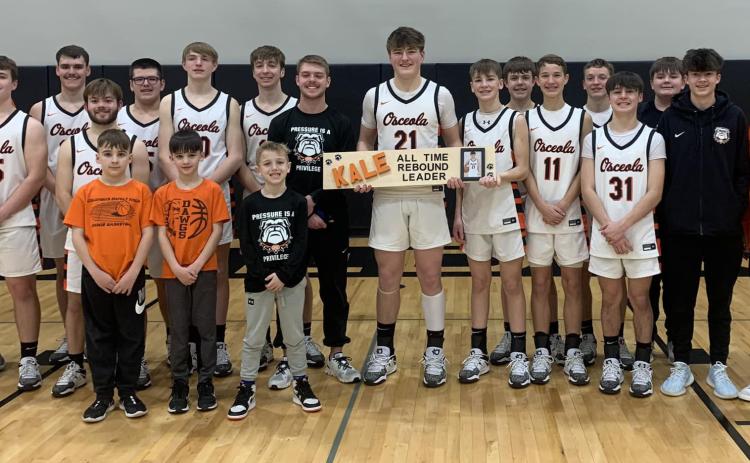 Kale Gustafson (center) is now the all-time rebound leader at Osceola. The junior big man broke a 56-year-old record that was previously held by Alan Gissler. Osceola Schools photo