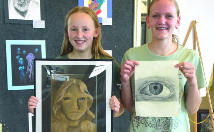 Above: Two home school students who take art from Tim Alvis display their work, Adalyn Hanson and Annadee Redden. Below: Some of the student art displayed in the gallery this month. PCN photos by Beth Sparrow.