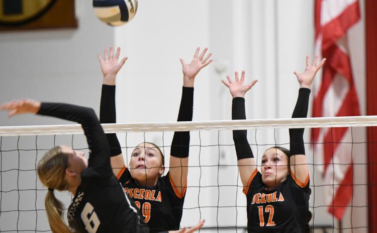 Graci Conkling and Alexis Burritt go for the block. PCN photo by Calvin Holtz.
