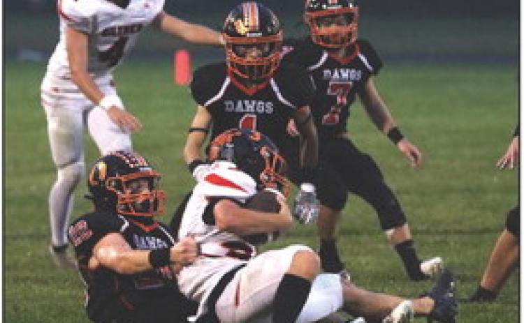 Aden Feezell takes down the Hornet carrying the ball. PCN photo by Blaine Winslow.