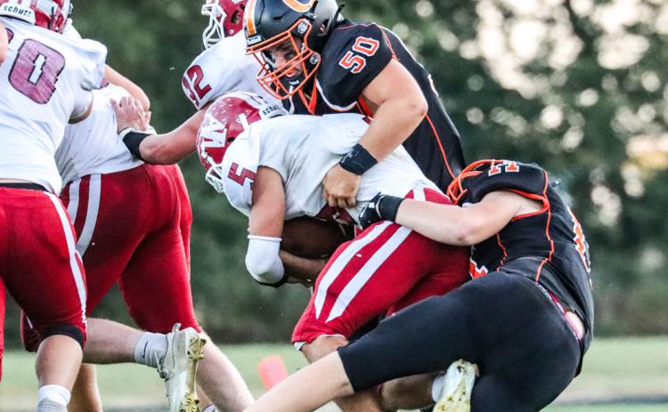 Bransen Lavaley and Braxton Mestl take down a Warrior Friday. PCN photo by Blaine Winslow.