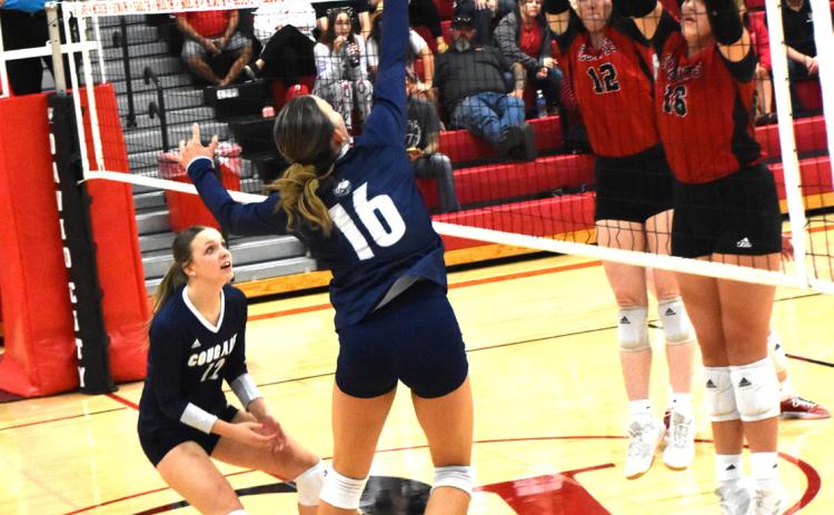 Ava Pruter gets a kill against David City. PCN file photo by Beth Sparrow.