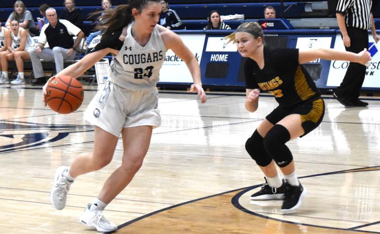 Lindee Kelley dribbles past a Mustang defender in their first game. PCN photo by Cienna Friesen.