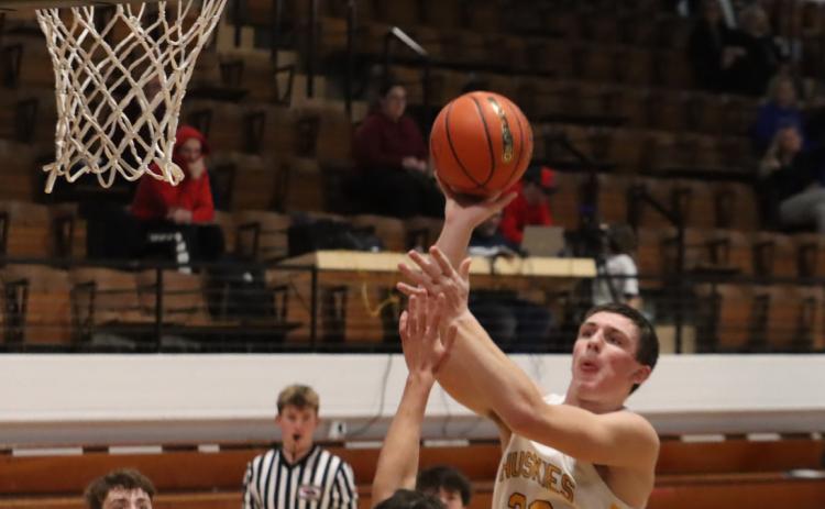 Shelby-RC sophomore Dylan Micek (32) gets a good look at the basket against the BDS defense on Saturday at the CRC Tournament in York. The Huskies defeated BDS 58-43. PCN photo by Ken Kush.