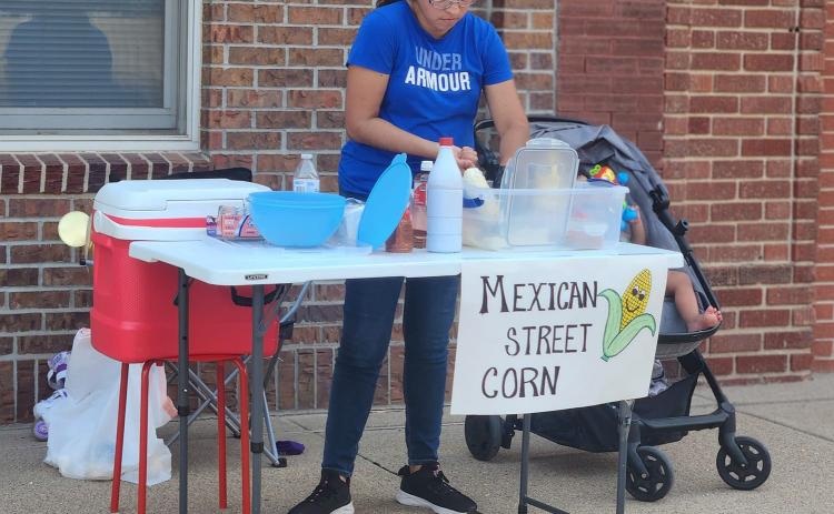Mexican Sweet Corn was available from this vendor. Below: Matt Allsman and Derek Klosner performed at the Shelby Farmers’ Market on Wednesday. Photos provided.