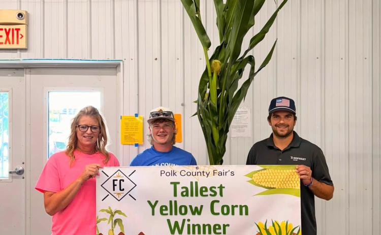 Above: A new category was tallest crop. Cody Butler (center) won with his corn which was 16’4” (Hoegemeyer Hybrid). Thank you Frontier Cooperative for sponsoring this event! Photo provided.