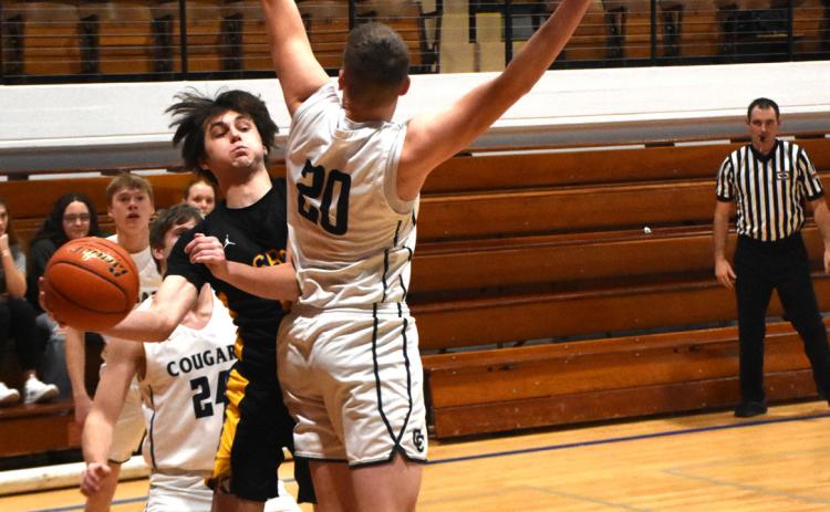 Brock Allen (CC) blocks Blake Schmidt (SRC) from the hoop. PCN photo by Beth Sparrow.