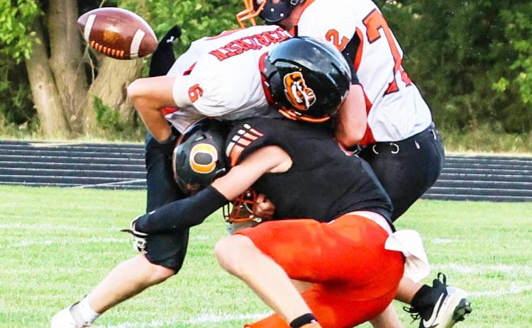 Osceola’s Landan Drozd seperates the ball from the Palmer kick-off return man and the ball is scooped up for an Osceola touchdown. PCN photo by Blaine Winslow.