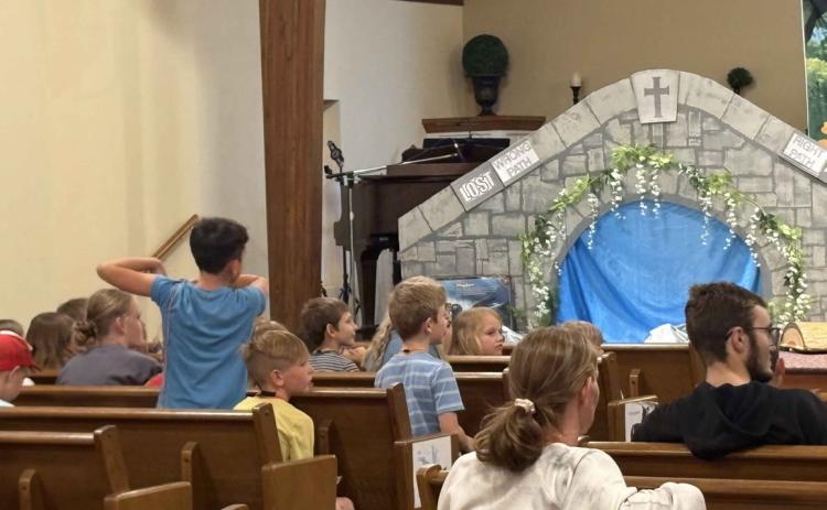 Vacation Bible School is going on now at Stromsburg Evangelical Free Church. Kids here are singing along with Summer Lukasiewicz and Lexi Eller (below) and answering what they learned (above). PCN photos by Beth Sparrow.