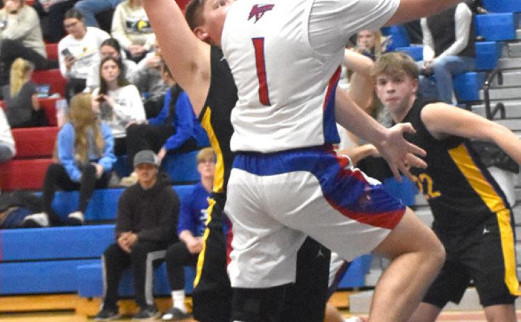 Left-High Plains 6-1 junior Kyler Hans (1) drives into the teeth of the Shelby-RC defense during Saturday’s Polk County match up in Polk