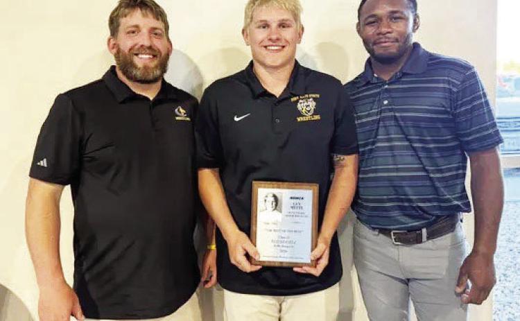 Shelby-RC’s Eli Fjell was named the Guy Mytty Class D wrestler of the year at the NSWCA Banquet on Friday night in Grand Island. Fjell won his second consecutive state title this season. Pictured is head coach Tanner Kuhn, Eli and coach Zemua Baptista. Photo was provided
