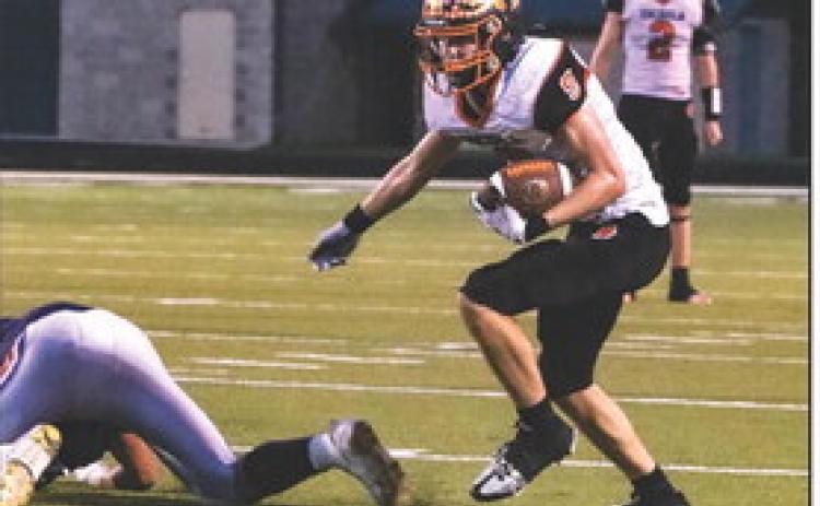 Hayden Lavaley gains some yards after a catch as Kale Gustafson looks on. PCN photo by Blaine Winslow.