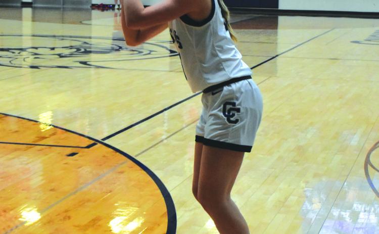 Edie Peterson goes for a trey. PCN file photo by Beth Sparrow.