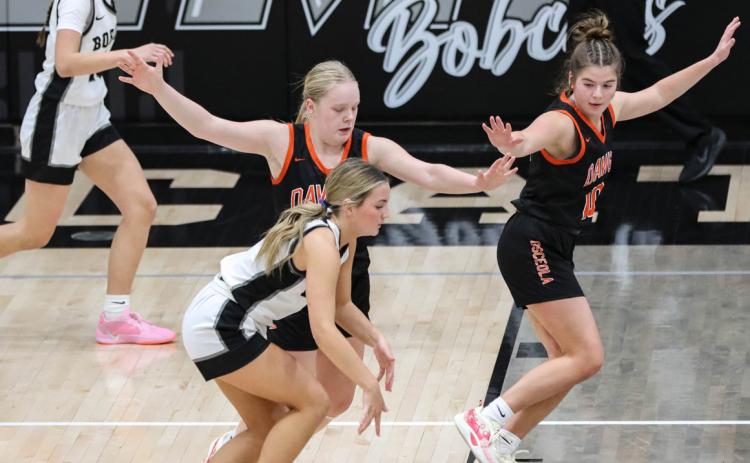 Janna Roberts and Addie Theis double team an EMF player on defense. PCN photo by Blaine Winslow.