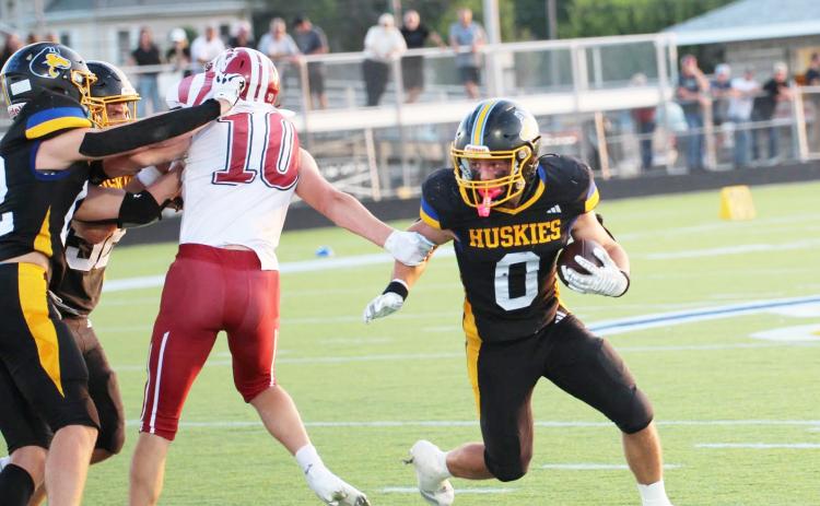 Senior Carter Eickmeier tries to turn the corner on the Fullerton defense in Friday night’s season opener in Shelby. Eickmeier ran for a team-high 93 yards on 17 carries in the team’s 42-6 win. PCN photo by Travis Lane.