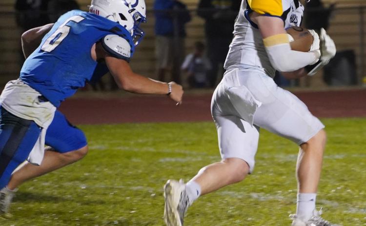 Coy Vrbka scoops up a fumble and runs it in for a touchdown. PCN photo by Jen Vrbka.