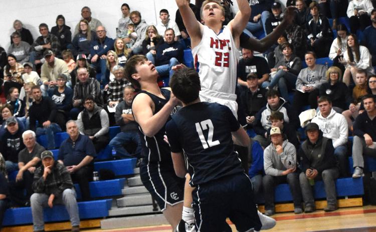 Brodey Spurling (HPC) and James Elgin (CC, behind him) fight for the rebound. PCN photo by Beth Sparrow.