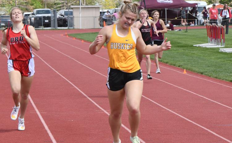 Ava Larmon competes in the 400m run last season at the district meet. PCN file photo by Rick Holtz
