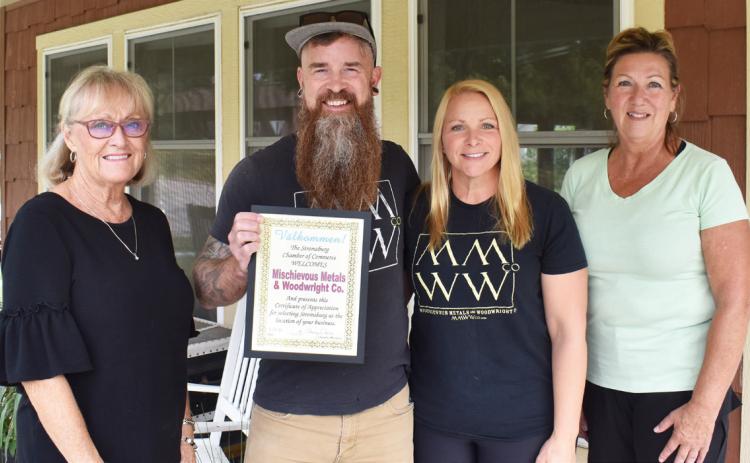 The chamber welcomes MMWW. Pictured are Cinda Koinzan, Jeff Lacy, Erin Lacy and Sherry Oberg. Polk County News Photo by Beth Sparrow