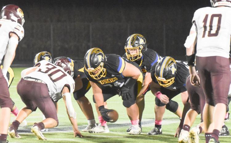 Top- Shelby-RC quarterback Jaxson Thompson takes the snap from under center. The junior signal caller capped three Huskies scoring drive on short scoring runs. Above- Sophomore Dayne Neujahr breaks outside the East Butler containment. PCN photos by Beth Sparrow.