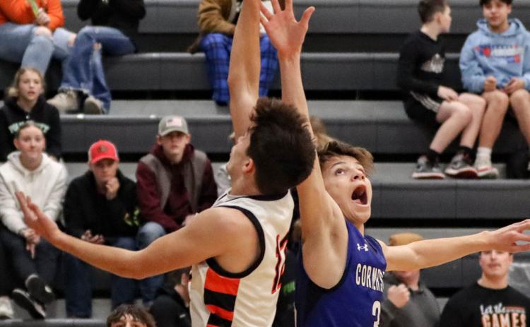Jackson Winslow goes for the layup while a Cornerstone Christian defender tries to stop him. PCN photo by Blaine Winslow.
