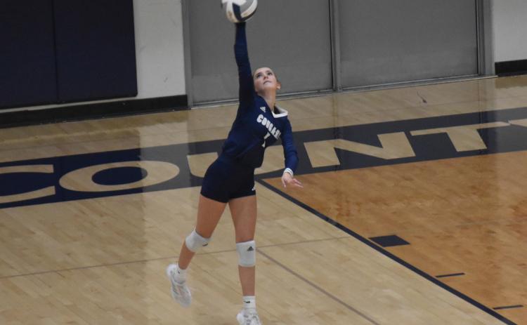 Cross County junior Ella Cramer takes her turn at the service line during Monday night’s D1-3 game at Cross County. PCN file photos by Beth Sparrow