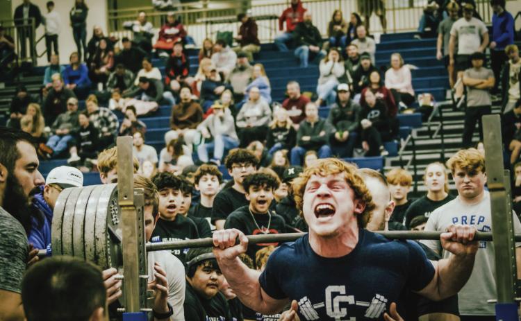 Cross County junior Izaac Dickey broke multiple state records on Saturday at the Creighton Prep Powerlifting competion in Omaha. Photos provided
