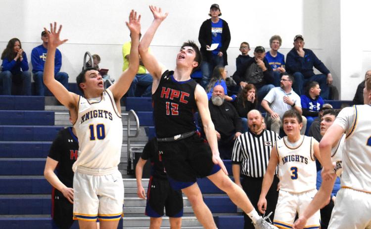 Haden Helgoth goes for the basket against Nebraska Lutheran. PCN photo by Cienna Friesen.