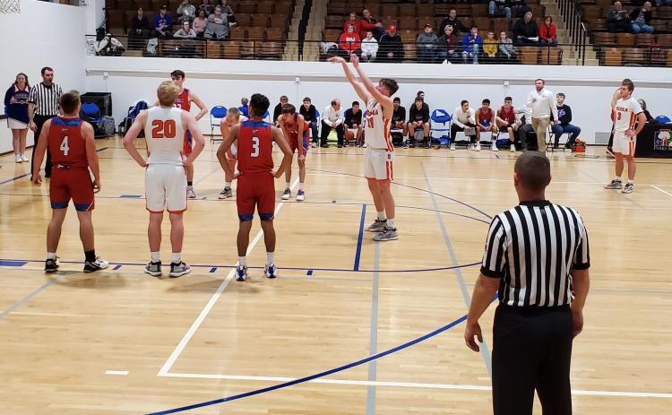 Bulldog Kale Gustafson shoots a free throw in the game against High Plains in the CRC in York. Photo by Craig Pinley.