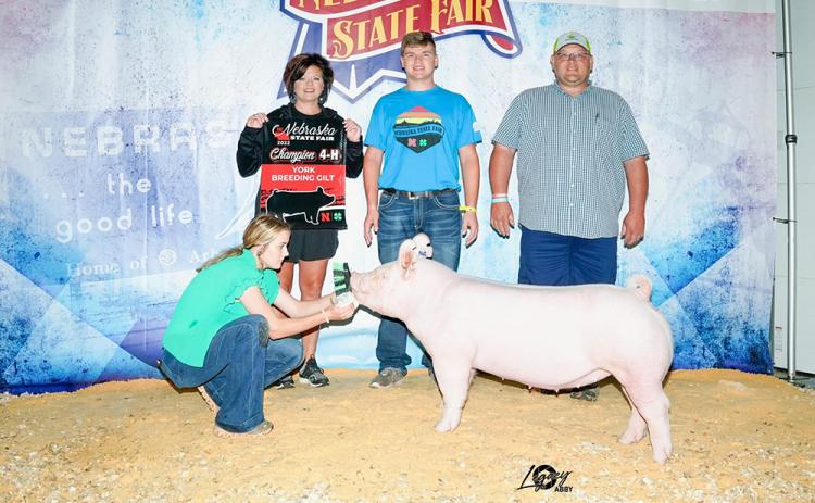 Collin Vrbka (center) is here with his Champion Yorkshire Breeding Gilt, along with his parents Jen Vrbka (left) and Corey Vrbka (right). Photo provided