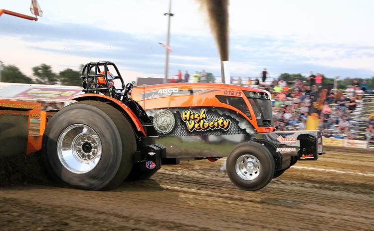 Kelsie and Garrett Davidson are third generation tractor pullers. What started with their grandfather, Leonard, and father, Todd, has turned into a weekend hobby for the duo. Garrett pulling in Rock Valley, Iowa.