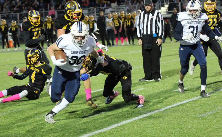 Izaac Dickey rushed for 255 yards and six touchdowns as the Cougars completed the undefeated regular season with a win over the Huskies. PCN photo by Travis Lane