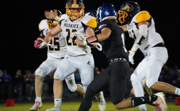 Coy Vrbka gets out in front of the run as a lead-blocker as Gabe Dutton-Mofford carries the ball for Shelby-Rising City on Friday night. PCN photo by Jen Vrbka