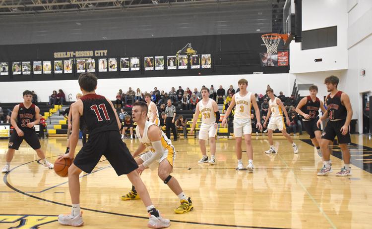 The Huskie defense held the Warriors to two points in the final 2:30 as Shelby-Rising City defeated Fullerton 64-53 in the opening round of the SRC Holiday Tournament. PCN photo by Beth Sparrow