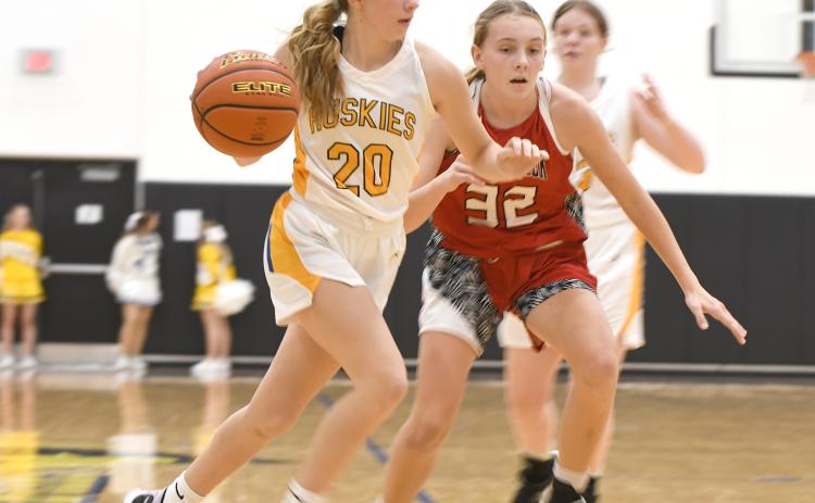 Danica Watts pushes the ball past the defender on Saturday against Sandy Creek. PCN photo by Rick Holtz