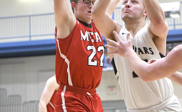 Alex Noyd gets down the lane for two of his 12 points. PCN photo by Rick Holtz