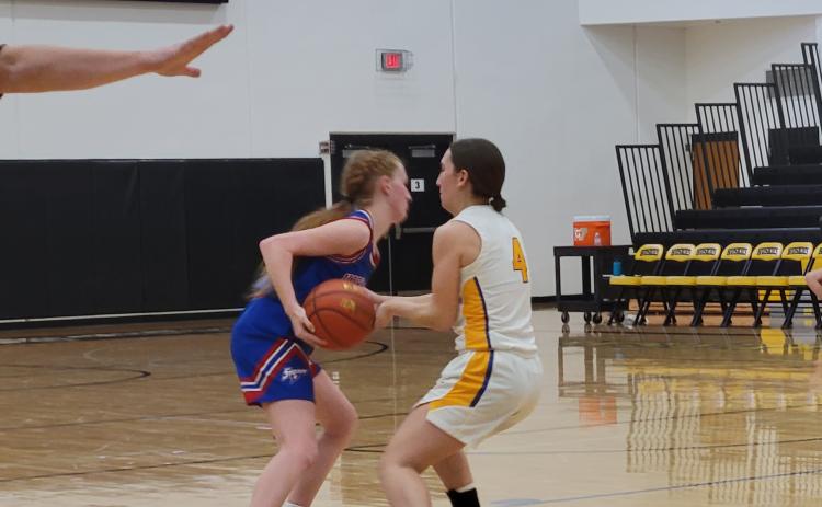 Peyton Hofmann tries to get around Angel Barnes.