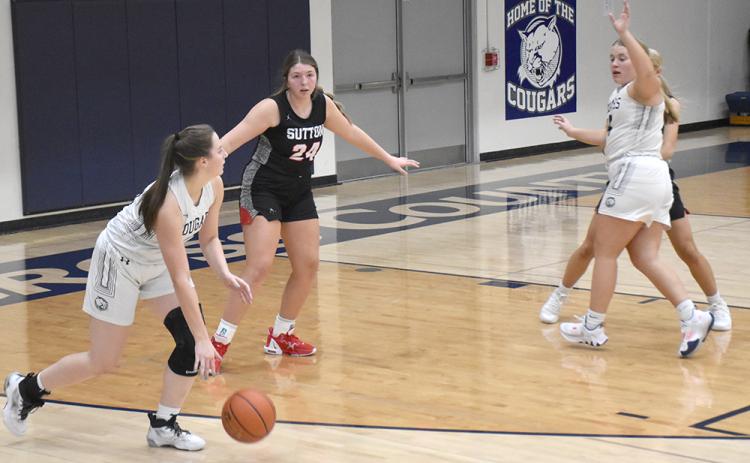 Adrienne Waller looks to make an interior pass to Chesney Sundberg on Thursday against Sutton. PCN photo by Beth Sparrow