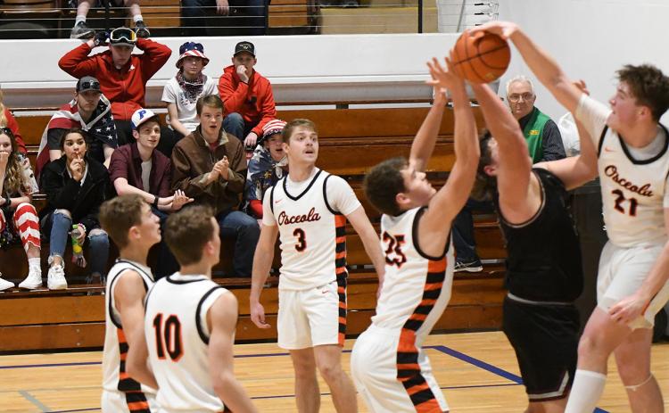 Kale Gustafson blocks a BDS shot during the second half on Thursday. PCN photo by Rick Holtz