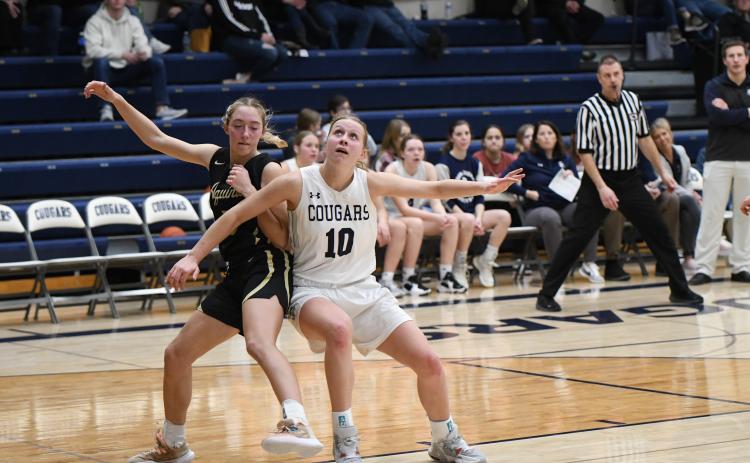 Lilly Peterson fights for position in the paint on Tuesday against Aquinas. Peterson finished with 5 points in the contest.PCN photos by Rick Holtz