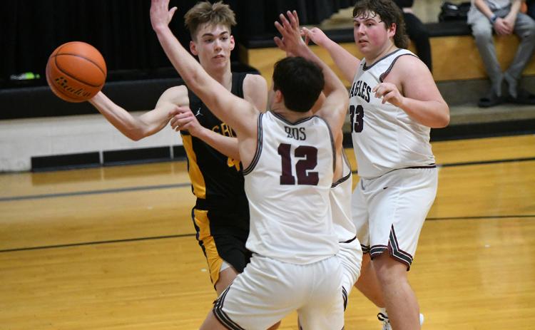 Isaac Whitmore passes out of a double team on Tuesday. PCN photos by Rick Holtz