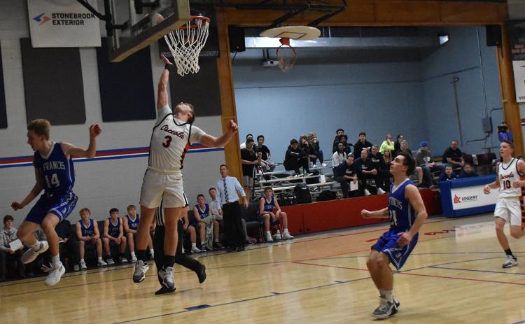 Isaiah Zelasney floats to the basket on a fast break for two of his team-high 24 points. PCN photo by Beth Sparrow