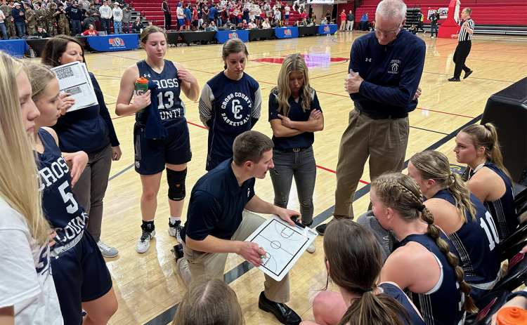 Cross County coach Mitch Boshart talks things over with his team during a timeout in the third quarter of Thursday's game with Crofton. PCN photo by Rick Holtz