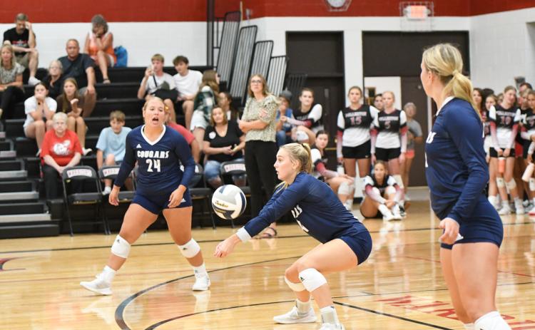 Shyanne Anderson (center) finished with 4 digs against Sutton. PCN photo by Rick Holtz