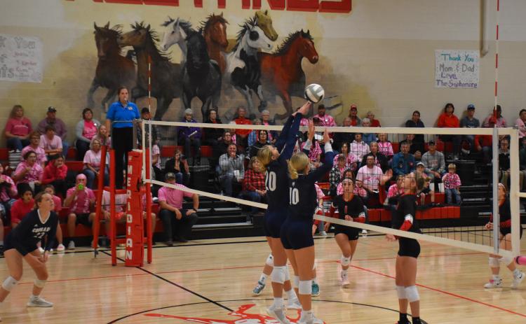 Lilly Peterson and Tierney Schoch go up for the block.