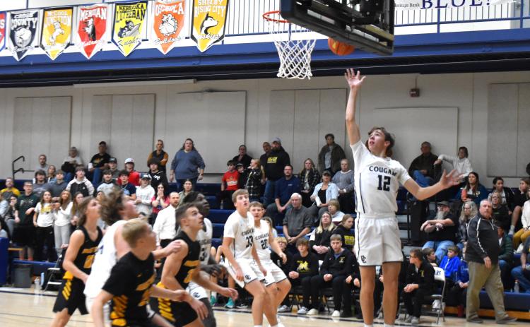 Thatcher Hanson takes the ball to the basket.