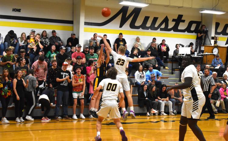 Gabe Dutton-Mofford shoots the three against McCool Junction. PCN photo by Alex Larmon.