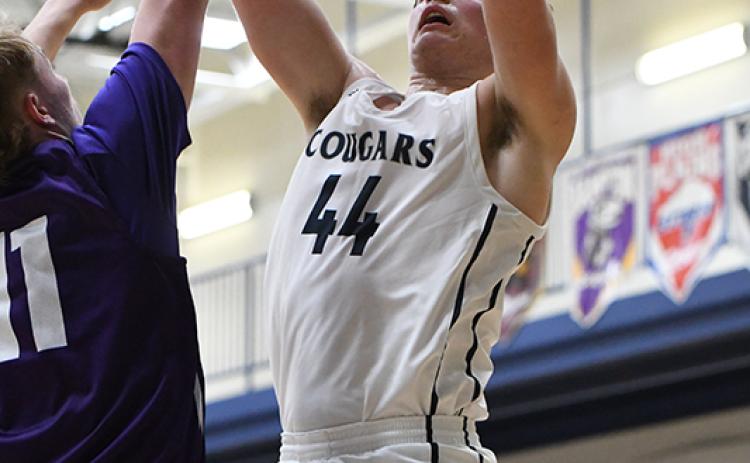 Tanner Hollinger finished with a team-high 13 points and grabbed 12 rebounds against Wood River. PCN photo by Rick Holtz