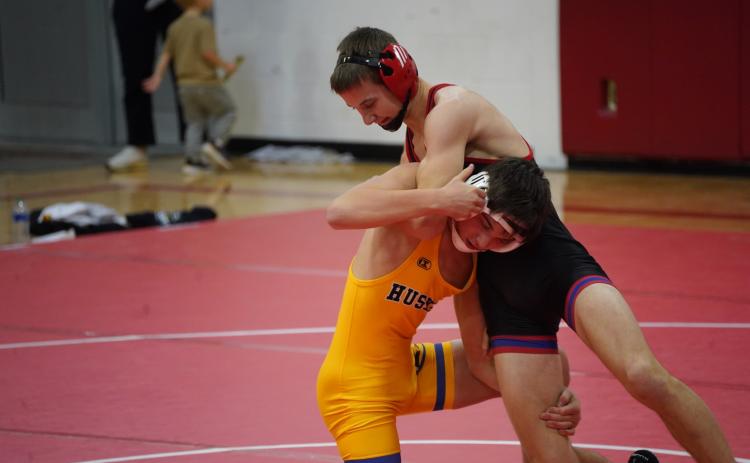 Owen Krafka (SRC) and Hudson Urkoski (HPC) wrestle at 120 pounds.