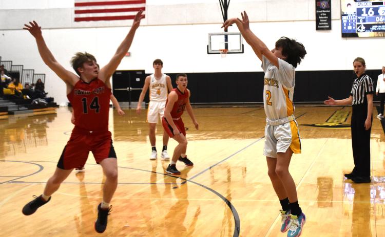 Noah Thelen shoots the three for the Huskies.
